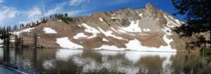 snow near mountain lake